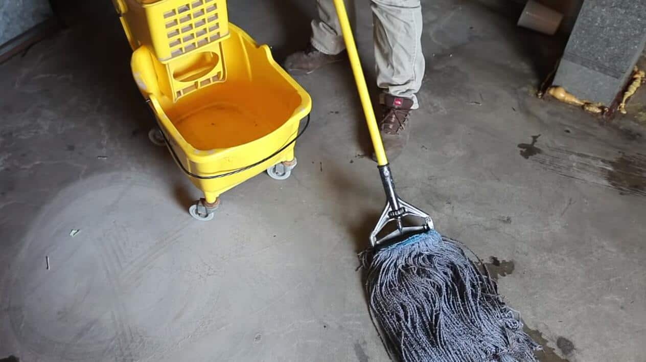 clean concrete basement floor with mop